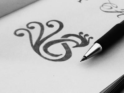 CarlaSimmons black initial jewellry lettering logo minimal monogram peacock swirls
