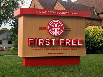 First Free Sign backlit branding church cross first free logo sign tree