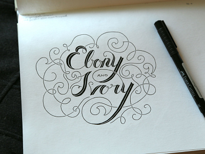 Ebony & Ivory black calligraphy ebony flourish handletter handtype ink ivory script swirl typography white