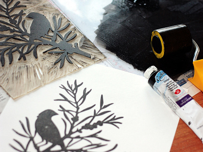 Linocut. А bird in the branches of sea-buckthorn handprinted ink linocut printdesign