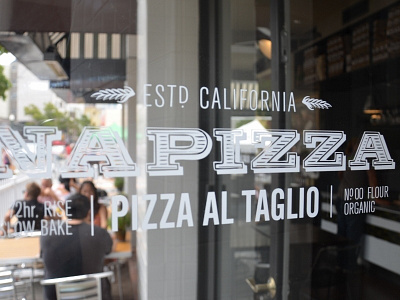 Napizza Logo in Window branding logo pizza restaurant window