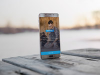 android phone on wooden table showcase - Android Phone on a wooden table