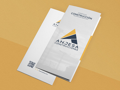 Anjesa - Trifold Brochure Design blue brand brand identity branding branding design concept construction construction company construction logo dark blue lines triangle logo triangular trifold trifold brochure yellow yellow logo