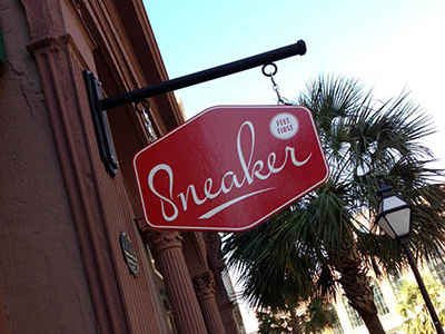 Sneaker Signage charleston foot hanging logo polygon red script shoe shoes sign sneaker street typography