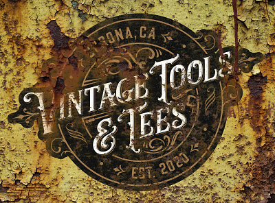 Vintage Tools & Tees logo on rusty panel branding decay design font logo painting rust typography vintage vintage logo weathered yellow