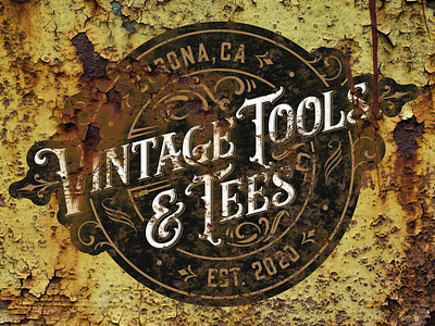 Vintage Tools & Tees logo on rusty panel
