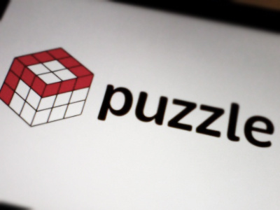 A Puzzling Logo. brevia cube logo puzzle red rubiks rubix typography