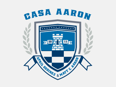 Casa Aaron Shield banner blue castle checkerboard design gray laurel logo navy shield typography