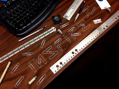 INSPIRE branding creative design desktop keyboard lettering mechanical metal paperclips rulers shine typography
