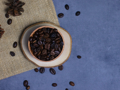 coffee beans on a wooden bowl and burlap