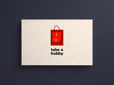 A logo with a red bag and button | Turbologo