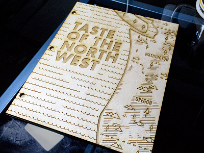 Taste of the Northwest book cover cookbook fish lasers map mountain tree water wood