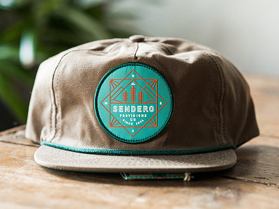 Sendero apparel badge branding hat illustration lockup logo nature outdoors river tree typography