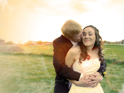 Dan and Paula beige flare happy kiss muted wedding