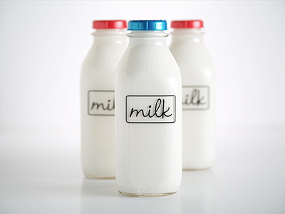 Milk bottles branding cereal dairy glass logo milk script typography