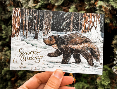 Wolverine in Wallowa Holiday Card adobe photoshop animal art conservation art endangered species gold foil gouache gulo gulo hand lettering holiday card ink nature neutral colors oregon art portland illustrator postcard art seasons greetings stationery watercolor wildlife art wolverine illustration