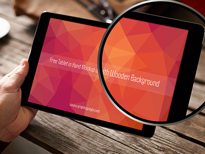 Free Tablet In Hand Mockup With Wooden Background free mockup ipad mockup mockup