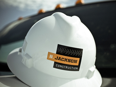 B. Jackson Construction apparel branding construction identity logo