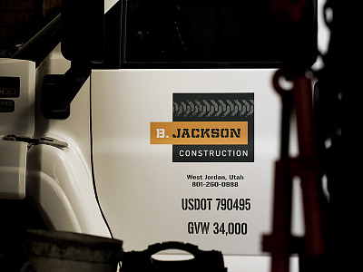 B. Jackson Construction Vehicle Graphics branding vehicle graphics visual identity