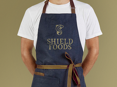 Shield Foods Apron apron branding fish gold identity logo seafood wordmark