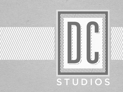 DC studios bussiness card grey logo