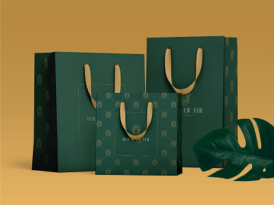Shopping bag design for House of THL luxury modest fashion brand bag bag design brand design branding design elegant fashion gold graphic design green luxury packaging packaging design shopping bag