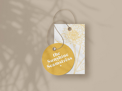 The Sunshine Seamstress Garment Tag brand design brand identity brand strategy branding design garment tag seamstress sunflower logo