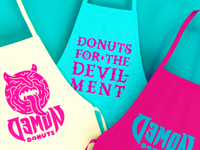 Semon Donuts Aprons aprons art direction branding clothing demon design devil donuts illustration nittygritty
