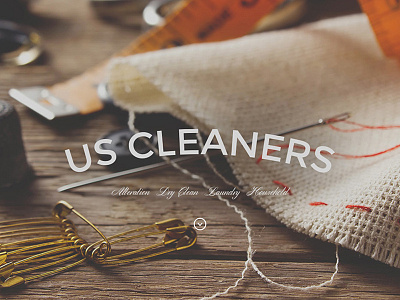 Homepage US Cleaners dry cleaners hero homepage logo sew tailor website wood