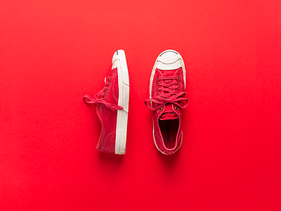 Photograph of red shoes converse jack purcell laydown lightroom photograph red shoes sneakers