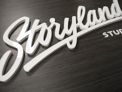 Storyland Studios calligraphy lettering logo sign signage