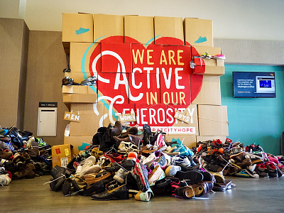 Lobby Installation – Barefoot Weekend box build cardboard church commons generosity handmade heart lobby paint shoes stack