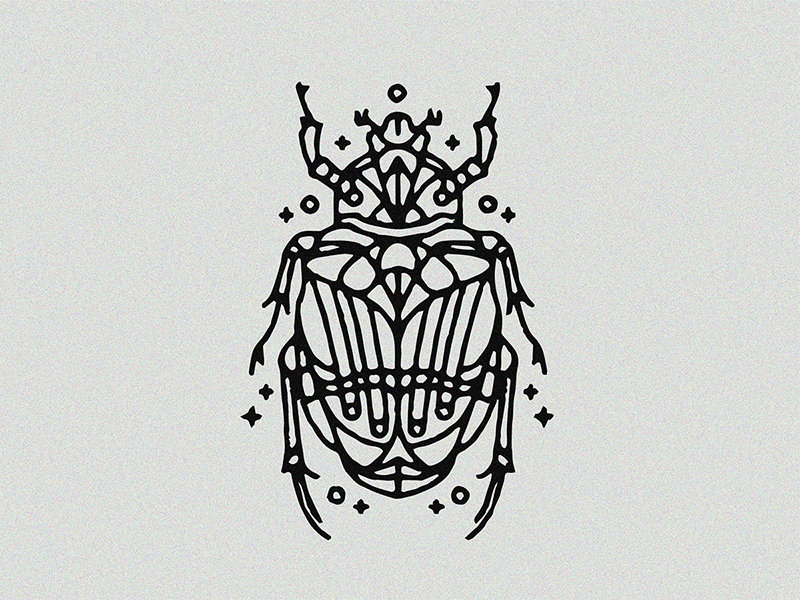Scarab beetle tattooed on the shoulder blade