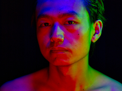 A colorful portrait illuminated by RGB tricolor light