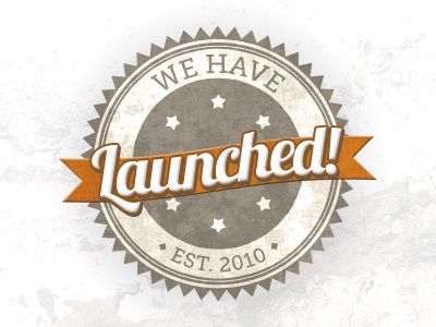 We Have Launched! badge crest grey illustrator lobster font orange ribbon texture typography vector