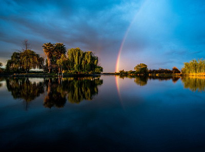 Calm during the Storm calm calming lake morning rainbow reflection storm