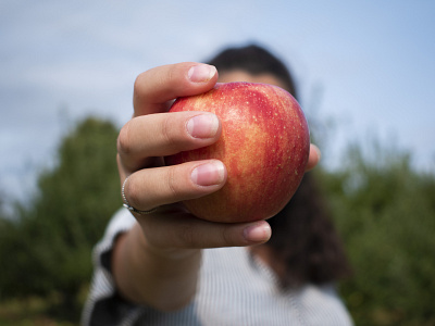 Hidden apple depth of field faceless portrait outside photography