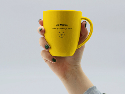 Hand holding Mug Mockup