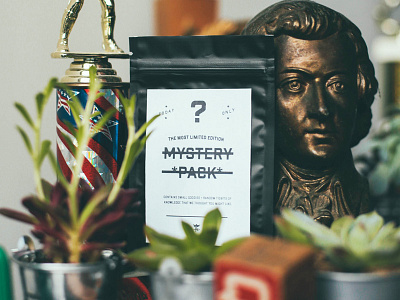 The Mystery Pack flint eastwood merch merchandise music neon gold package design packaging packaging design t shirt