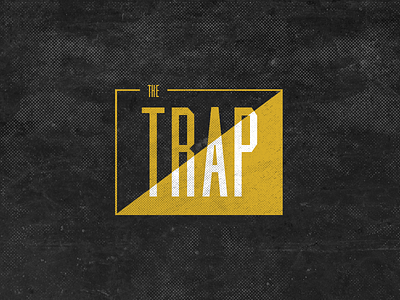 The Trap black logo yellow