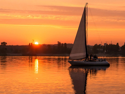 Beautiful sunset with yacht sail