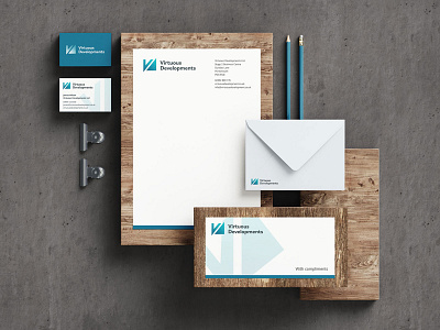 Virtuous Developments brand identity blue brand design brand identity branding design layout design logo logo design logo designer print design