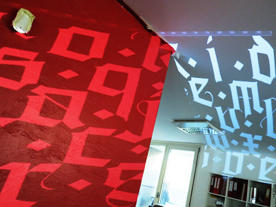 Ogilvy Office black calligraphy letter light ogilvy projection sofia