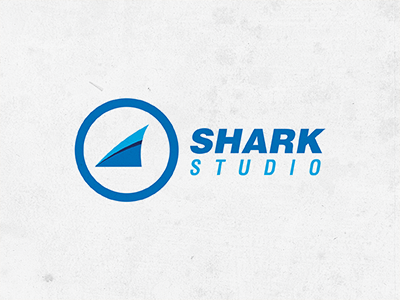 Shark Studio blue circle fin fish logo shark studio