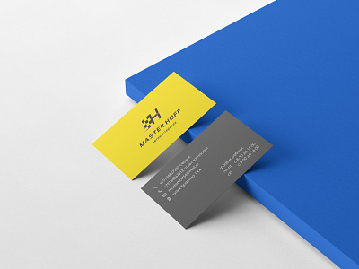 Yellow business cards for a car repair shop