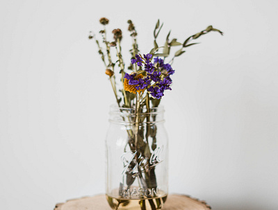 photo of a jar of flowers branding design