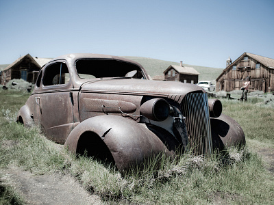 Old car in a farm field