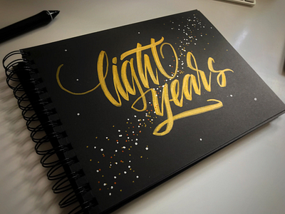 Light years brush script hand lettering