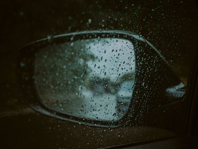 reflection in the car mirror in rainy weather