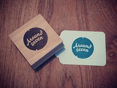 Around Seven Stamp logo stamp wood